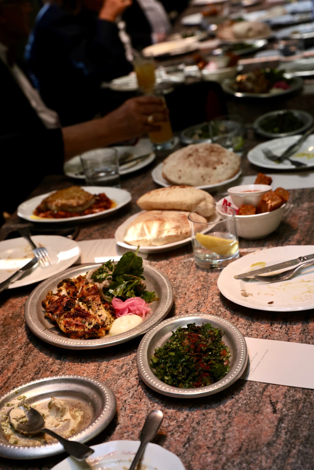 Shared dishes, flatbread and mezze along the table at the Brisbane lunch